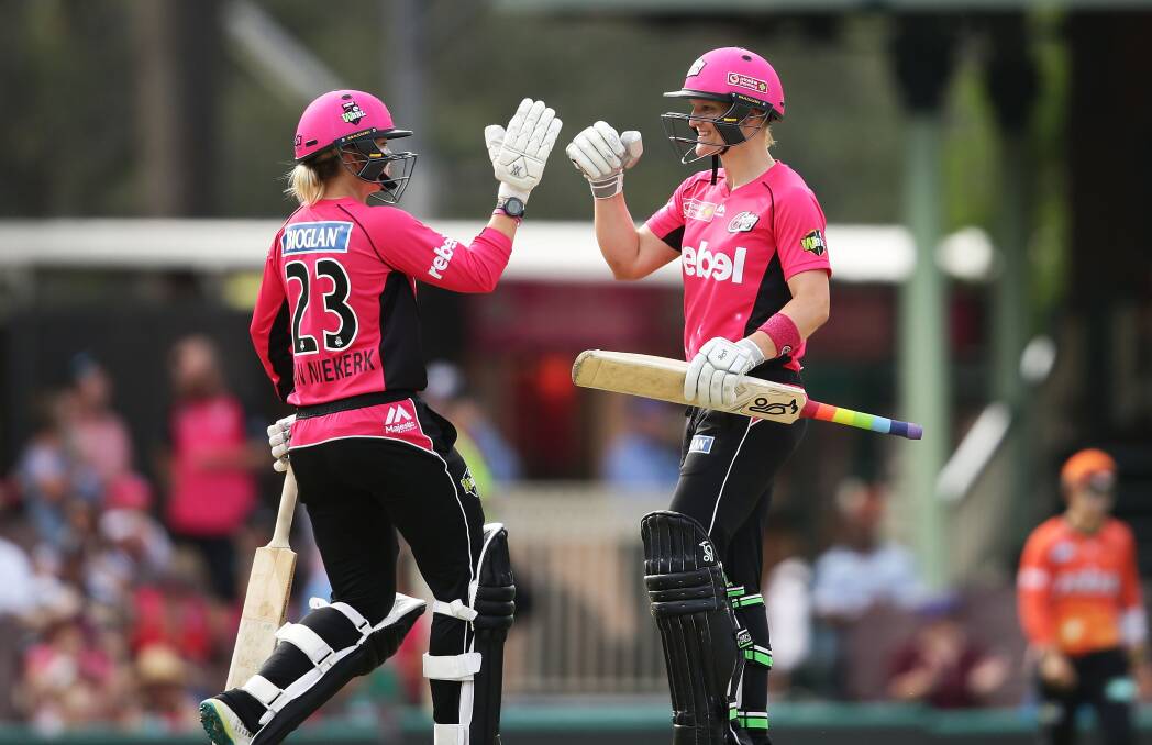 IMPRESSIVE: Sixers duo Dane van Niekerk (left) and Sarah Aley Sixers celebrate after hitting the winning runs in their Women's Big Bash League match on Monday.