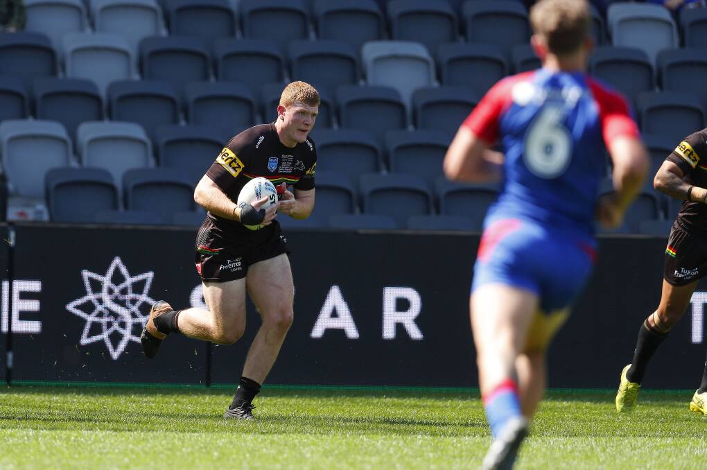 Prop Brad Fearnley runs at Newcastle's defence in the Jersey Flegg Cup grand final. Picture by Bryden Sharp