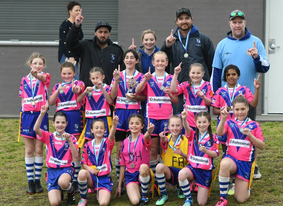 CHAMPION EFFORT: St Pat's under 11s celebrate their league tag title success after a golden try victory on Sunday over the Mudgee Dragons. Photo: CHRIS SEABROOK