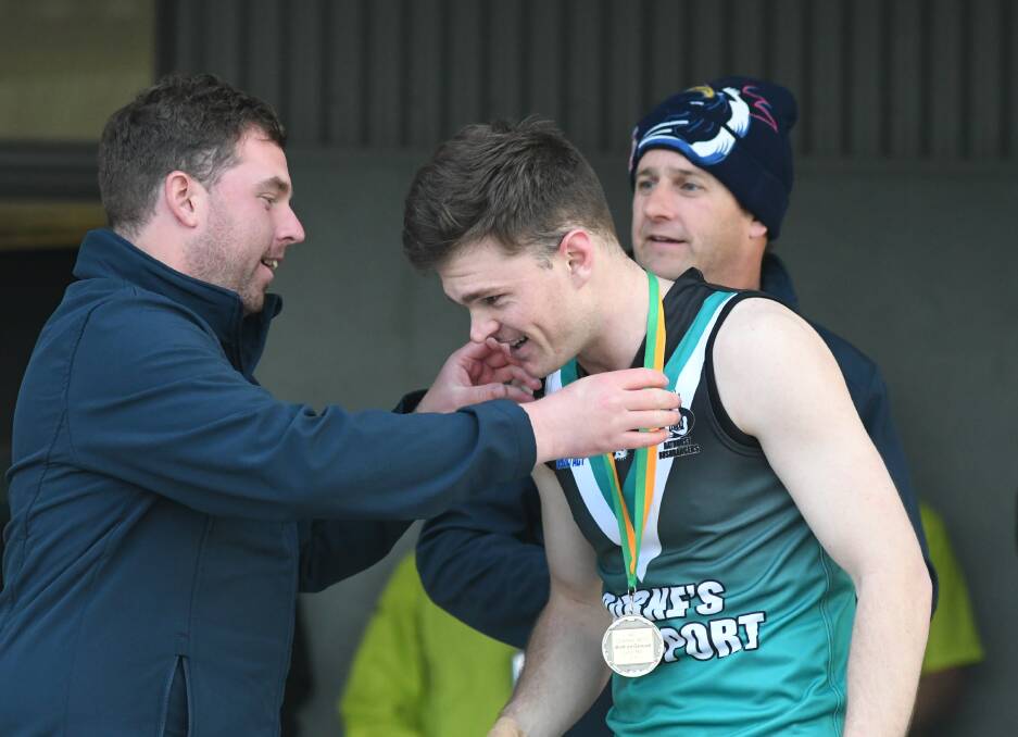TOP JOB: Bill Watterson is presented with his best on ground medal. Photo: CHRIS SEABROOK