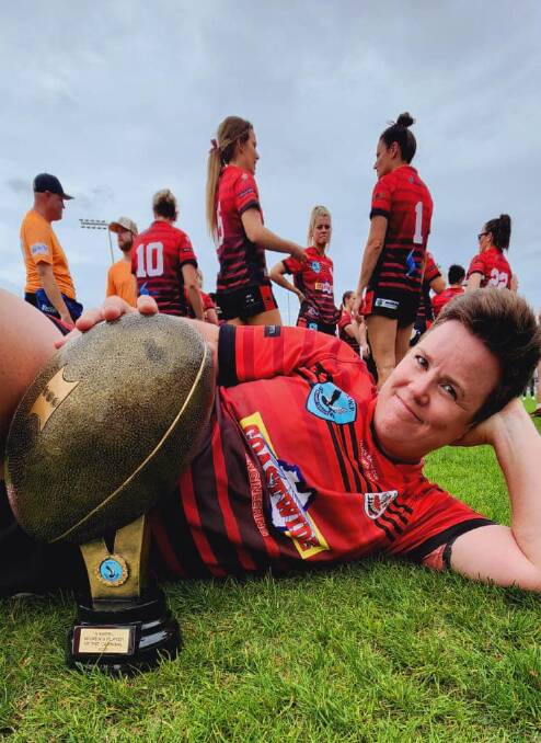 THE SPOILS: Marita Shoulders with her women's player of the carnival trophy. Photo: CONTRIBUTED