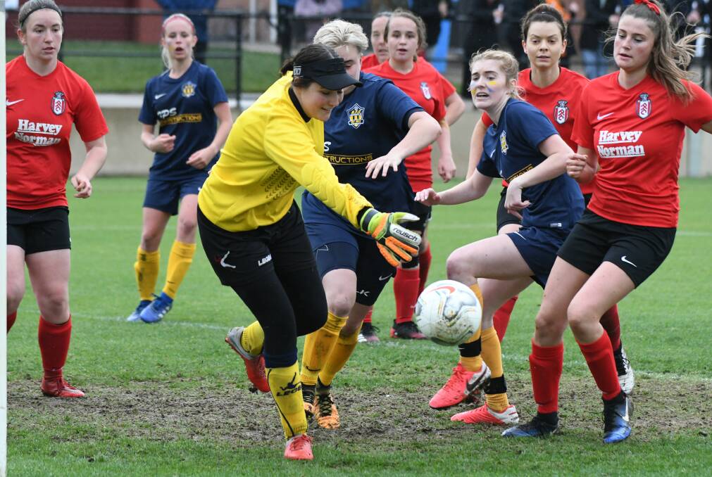 SCRAMBLE: Panorama goalkeeper Emily Risch can't get to the ball after a touch from Abercrombie's Georgie Carr (obscured). Her shot made it 2-all. Photo: CHRIS SEABROOK