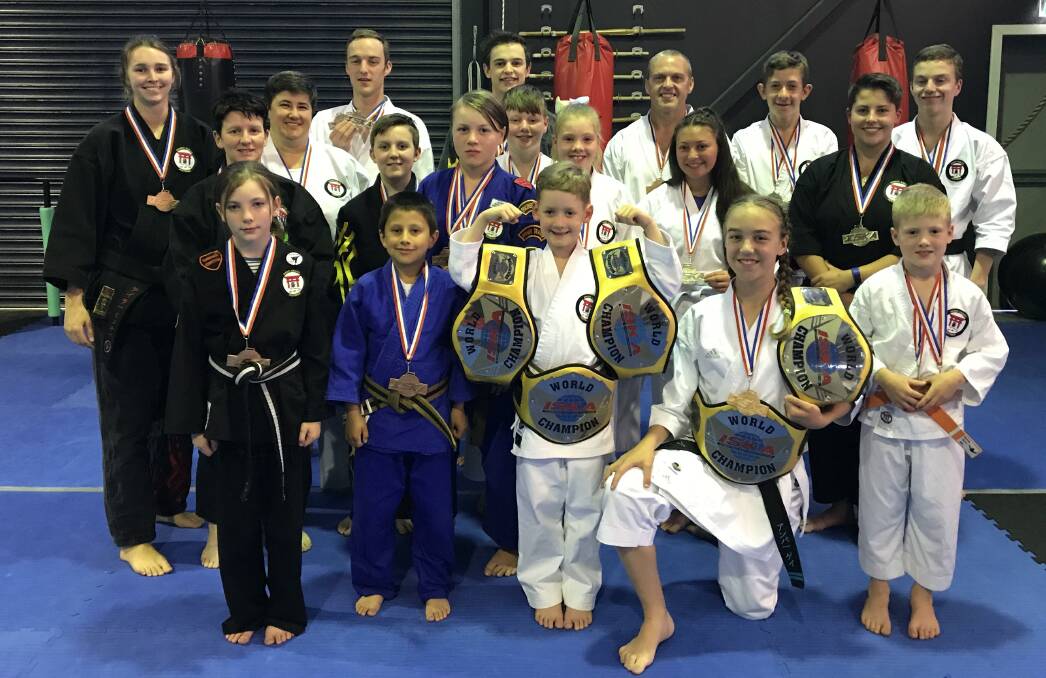 IMPRESSIVE: The Precision Martial Arts Bathurst team which placed seventh at the International Sport Karate Association World Cup, from left, front row: Olivia Duffey, Adan Coello, Keelan Ruston-Walkom, Amber Gay, Tyler Breen. Middle row: Taylor Hickey, Tracey Gunning, Sara Ruston, Jaiden Gunning, Naz O'Connor, Jacob McGovern, Abby Breen, Michaela Doungmanee, Maddie Graham. Back row: Brodie Gay, Jordan Hickey, Jason Gay, Reubin Delaney, Aaron Gay. Photo: CONTRIBUTED