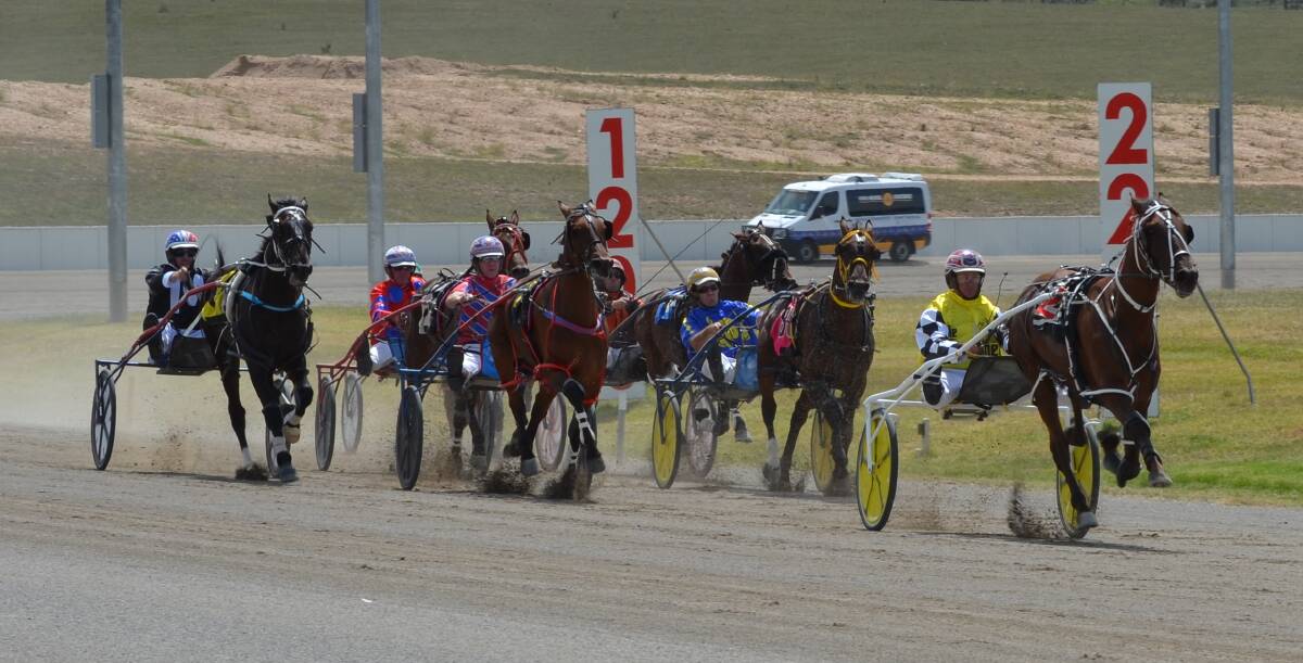 ON THE WAY HOME: The Grogfather leads the way after turning for home at the Bathurst Paceway. Photo: ANYA WHITELAW