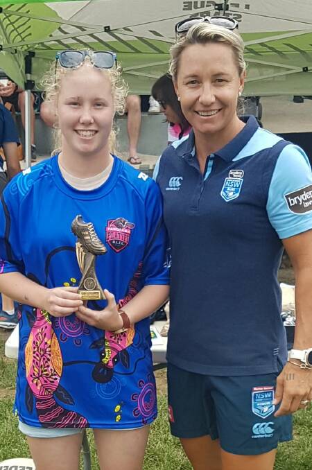 TOP DEBUT: Panorama's Madison Marmion was named joint winner of the Western Women's Rugby League under 18s best and fairest. Sydney Roosters star Kylie Hilder presented her with the trophy. Photo: PANORAMA PLATYPI