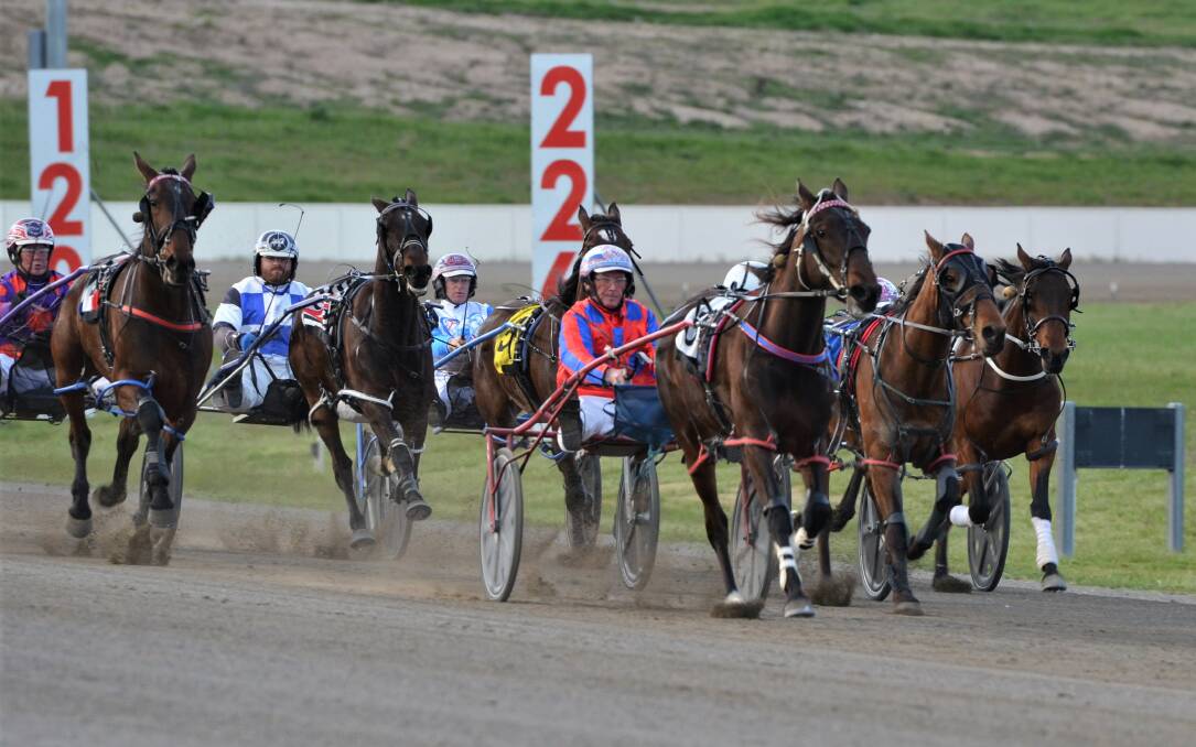 LEADING THEM HOME: Steve Turnbull guides Joes Redemption down the home straight and towards victory at the Bathurst Paceway. It was one of two wins for his Radiant Lodge team on Wednesday night. Photo: ANYA WHITELAW