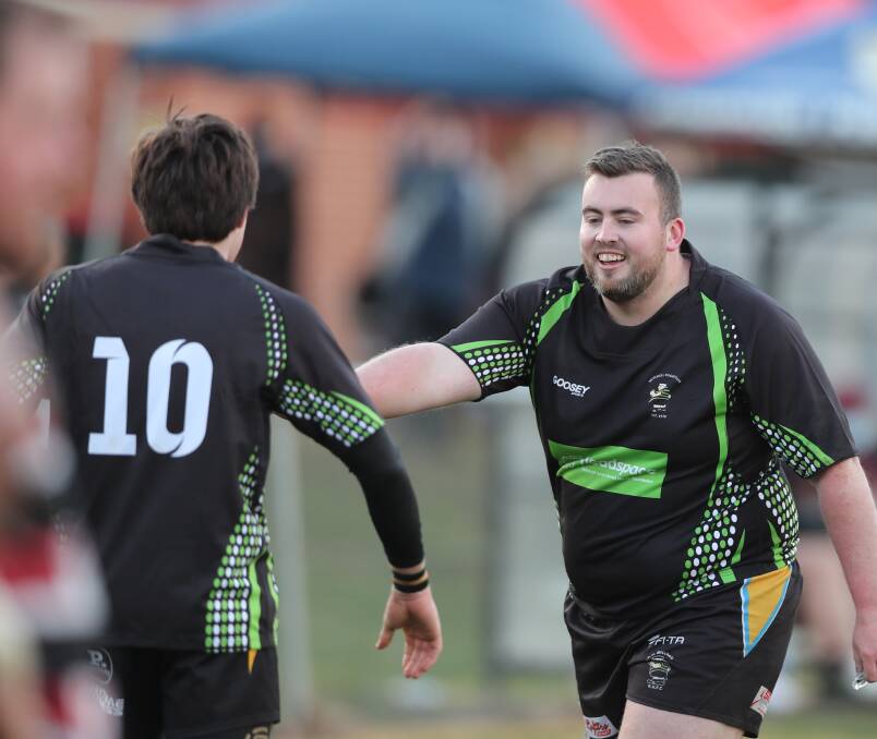 BIG DAY OUT: CSU flyhalf Ethan Cusick and prop Marcus Burrell celebrate a try in their win over Parkes. Photo: PHIL BLATCH