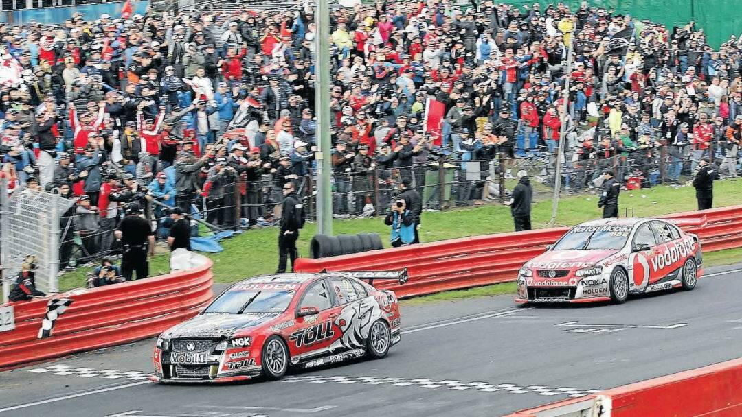 FLASHBACK: Garth Tander in the #2 Holden Racing Team Commodore leads home Craig Lowndes in the #888 Commodore to win the 2011 Bathurst 1000. Photo: PETER FORAN