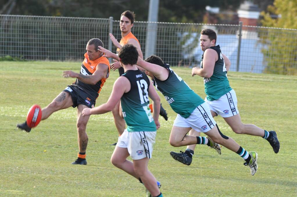 SINK THE BOOT IN: Damian Cuff - a former Bushranger - pumps the ball forward for the Bathurst Giants. Photo: CHRIS SEABROOK
