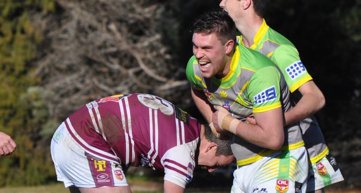 LAUGH IT UP: CYMS Robbie Mortimer enjoys a try against his brother, Blayney coach Tim on Sunday. 