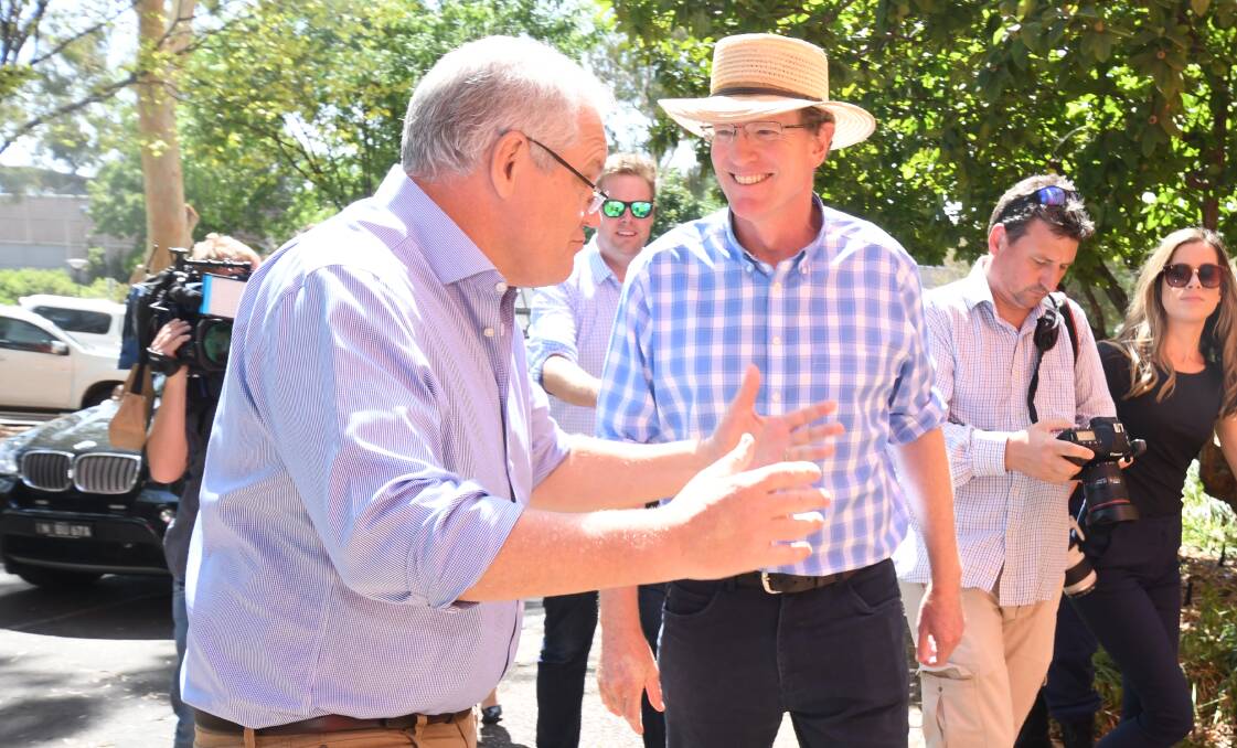 ALL SMILES: Andrew Gee greets then Prime Minister Scott Morrison during a trip to Orange to announce drought relief funding in January, 2020. Photo: JUDE KEOGH