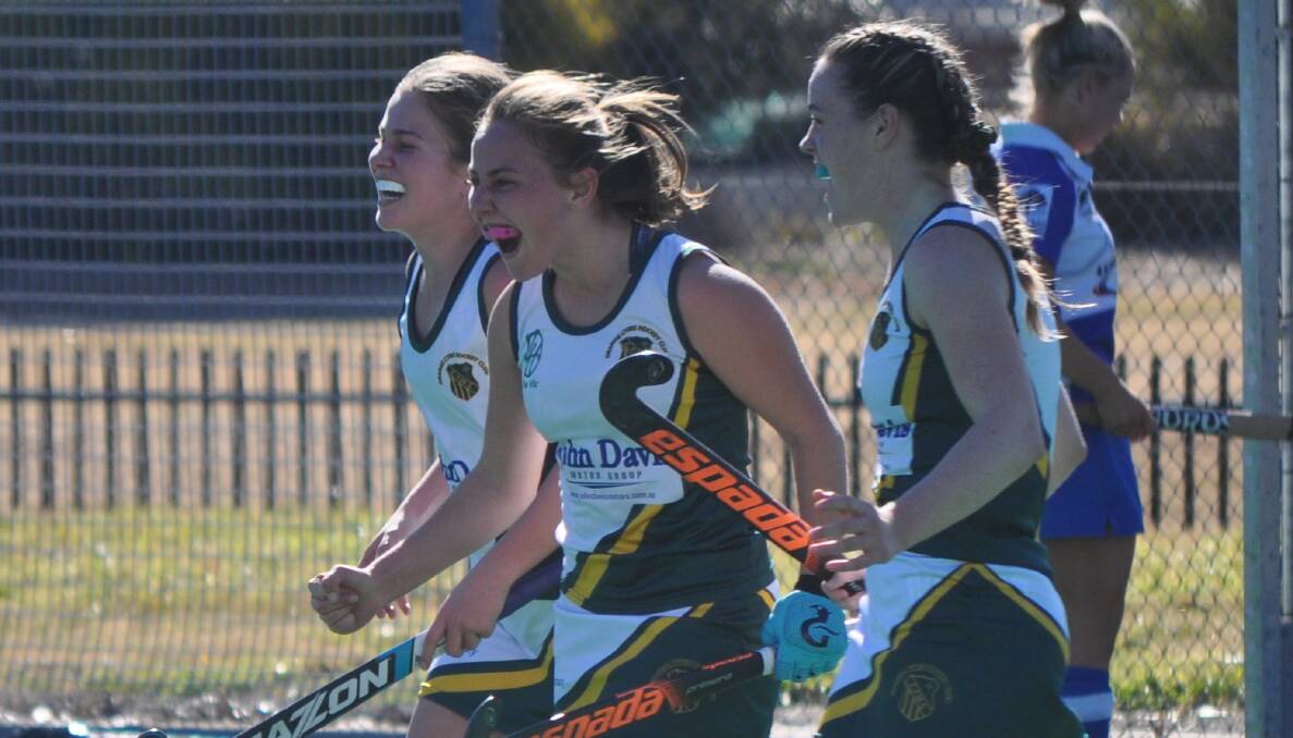 YOU BEAUTY: Pip Mannix (centre) celebrates scoring the match-sealing goal for CYMS in Saturday major semi-final victory over St Pat's. Photo: NICK McGRATH