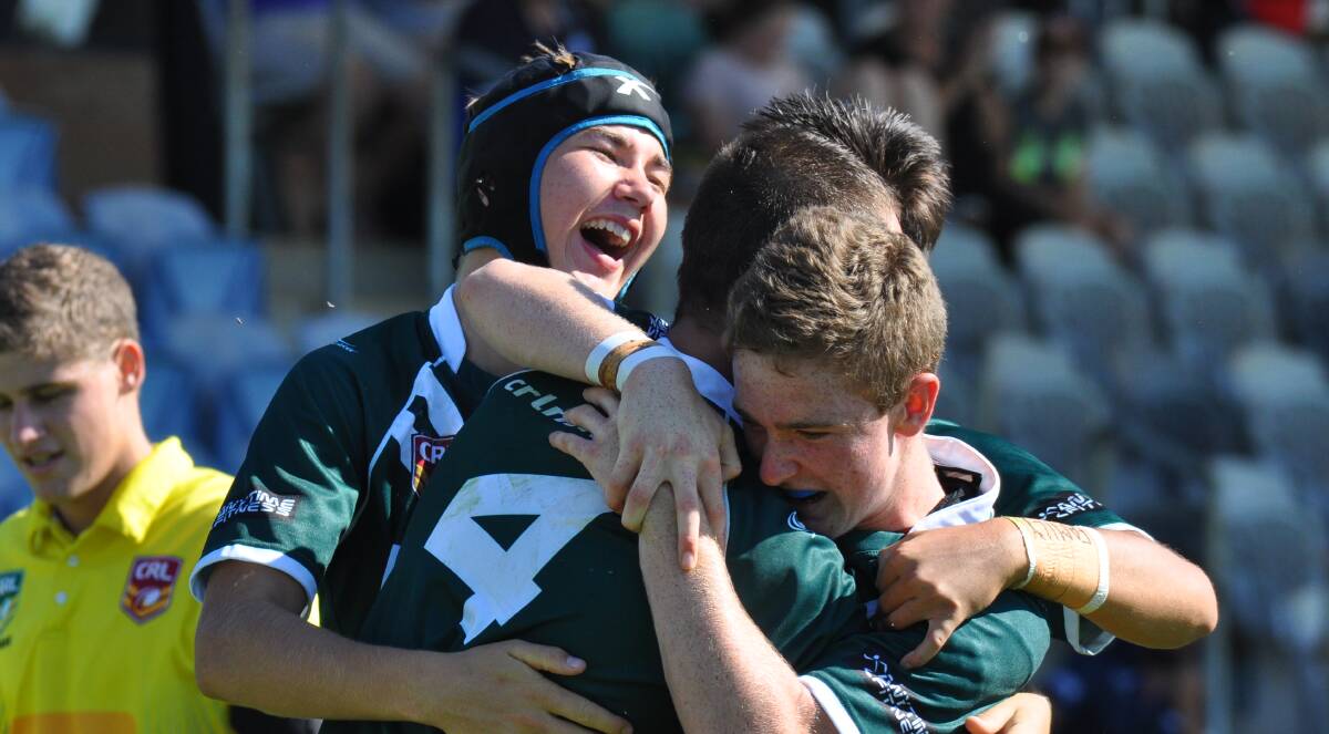 ENJOYING IT: Rams centre Mason Pollack is swamped by team-mates Tyler Colley, Cooper Monk and Rylee Blackhall (obscured) during Western's semi-final victory. Photo: NICK McGRATH