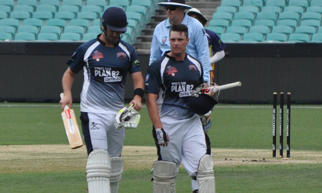 ONE TO REMEMBER: Wranglers batters Josh Doherty and Adam Ryan leave the SCG after the completion of Central West's innings on Tuesday. Photo: NICK McGRATH