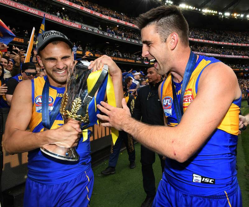 Dom Sheed (left) and Elliot Yeo of the Eagles hold the premiership trophy after winning during the 2018 AFL Grand Final.