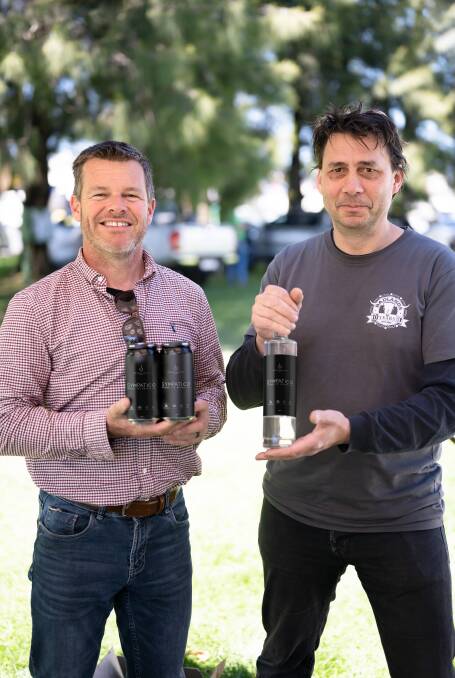 SYMPATICO: Stone Pine head distiller Ian Glen from Bathurst and Badlands head brewer Jon Shiner of Orange have worked together to create Sympatico beer and gin. Photo: SUPPLIED
