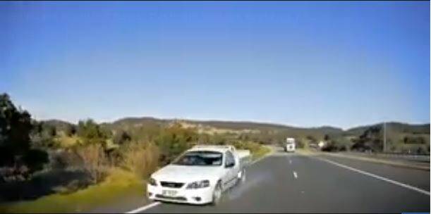 WRONG WAY: Police have labelled a video of a driver performing a U-turn into oncoming traffic as an act of stupidity. Photo: Dash Cam Owners Australia
