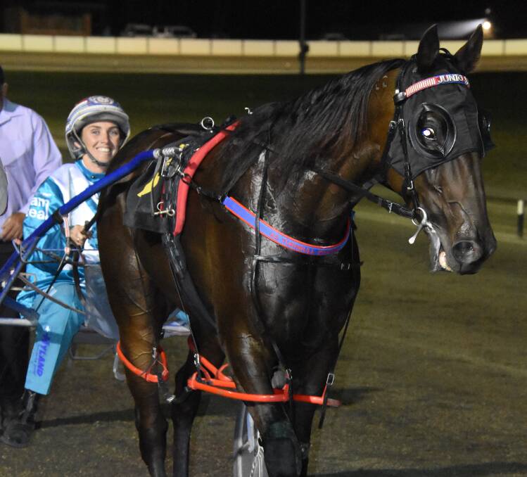 TRIUMPH Amanda Turnbull won the Young Pacers Cup with Atomic Red on Friday night. Photo: DAILY ADVERTISER