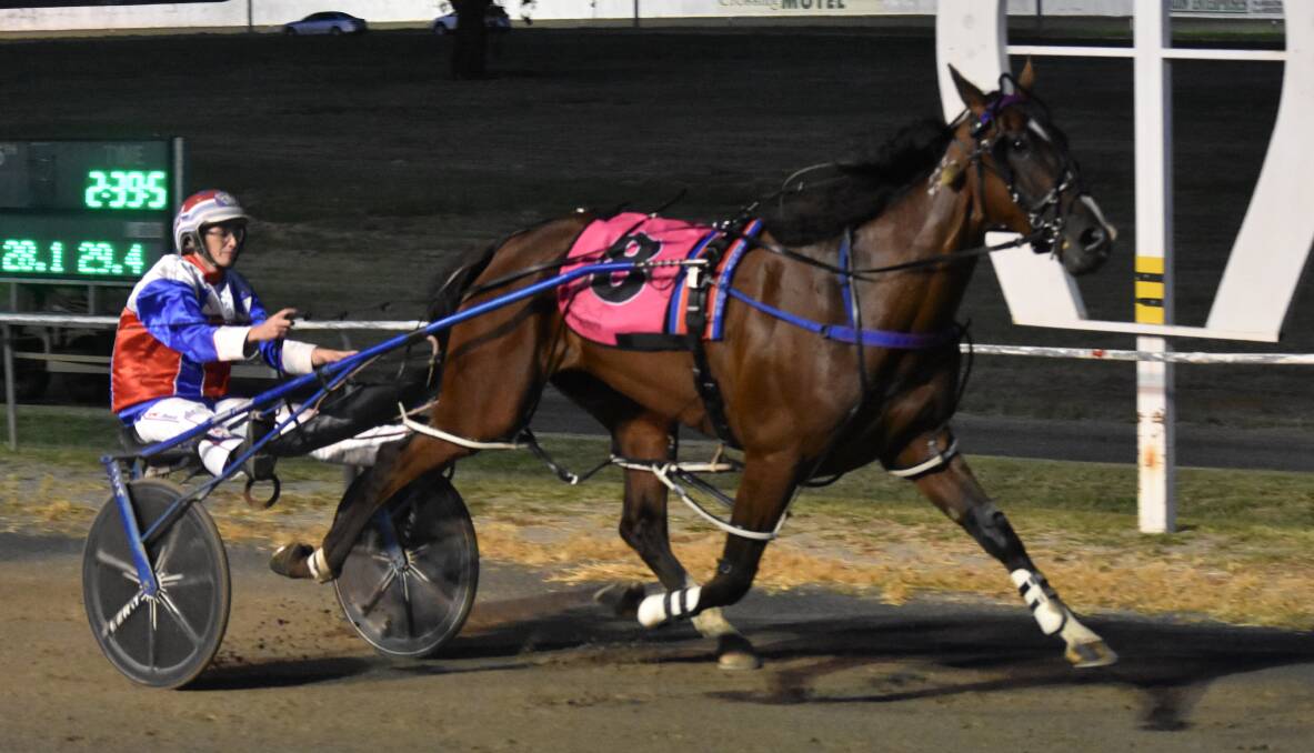 TAKING IT OUT: Amanda Turnbull guides Fasika to victory in the Junee Pacers Cup on Tuesday night. It was one of three training wins for her. Photo: COURTNEY REES