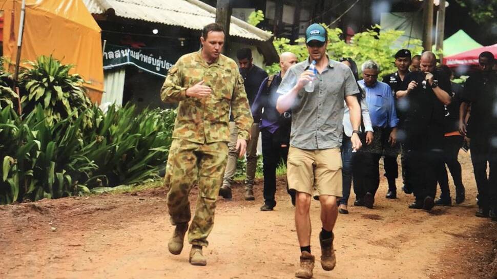 Major Alex Rubin briefs Dr Richard Harris on arrival at the Thumluang Cave rescue site.