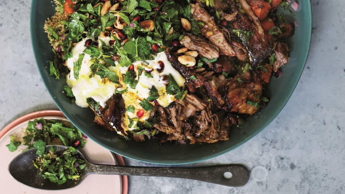 Slow-roasted pomegranate lamb shoulder with jewelled couscous. Picture: William Meppem