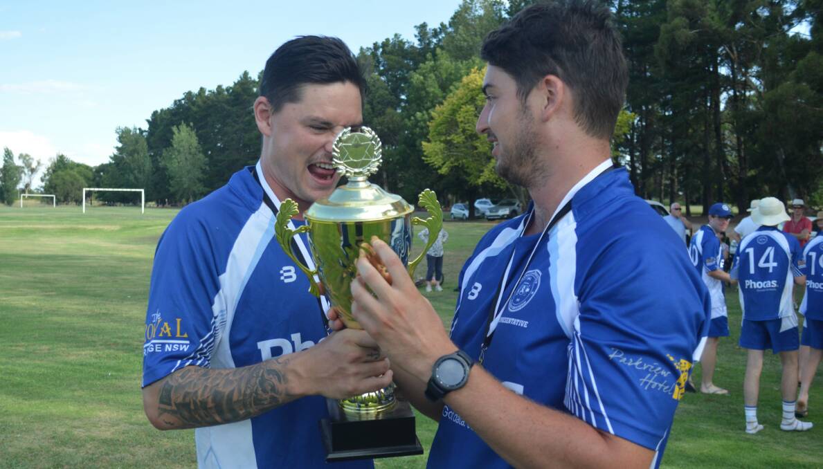 BLUE MOON: Ed Morrish and Josh Doherty celebrate last summer's title win, the former is hopeful of leading the Bluebaggers to another victory.