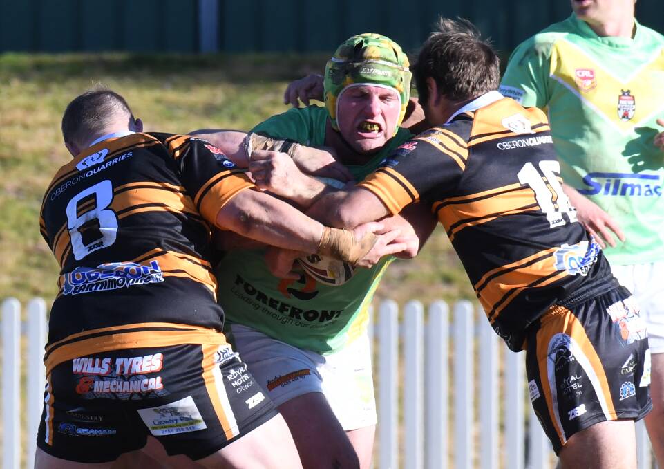 PROP LIFE: Orange CYMS' Cam Jones has taken it upon himself to try and stifle Bathurst Panthers' gun front-rower Brent Seager. Photo: CARLA FREEDMAN