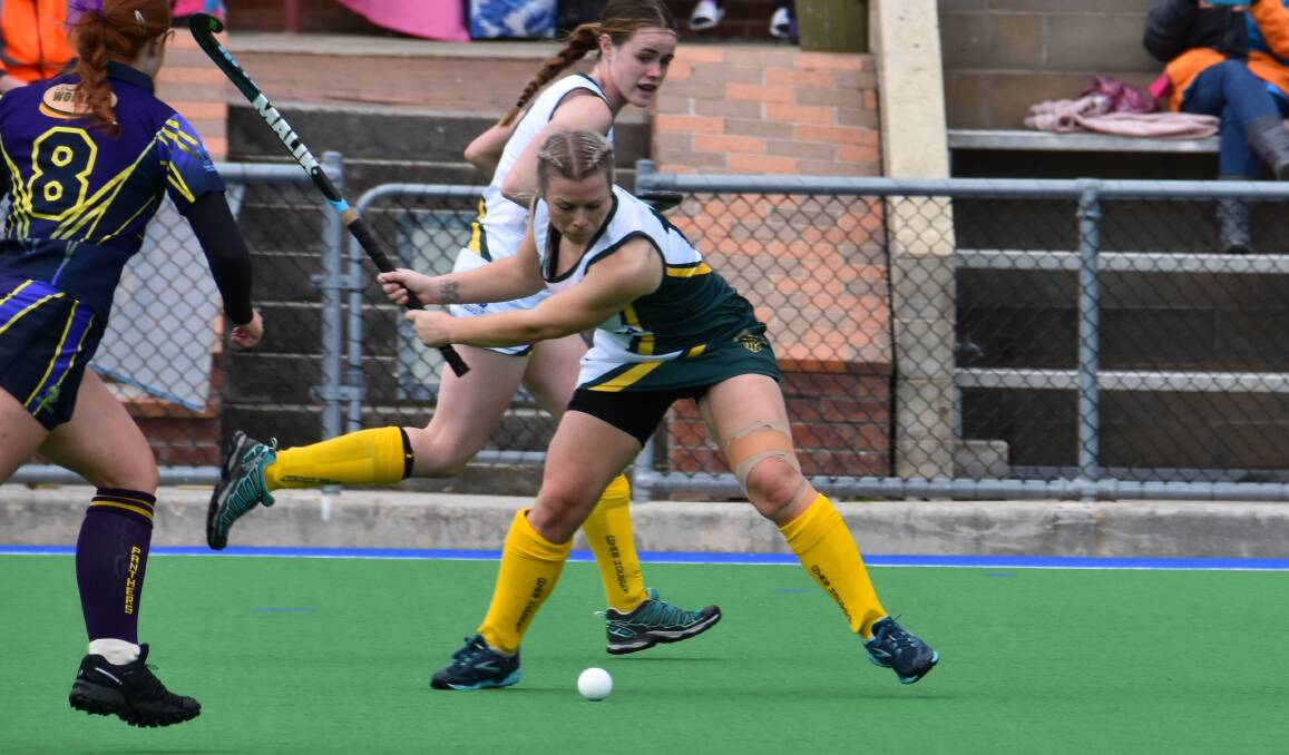 GREEN AND BOLD: Former Hockeyroo Jade Georgiou winds up in CYMS' stunning upset of Panthers on Saturday. Photo: PHOEBE MOLONEY