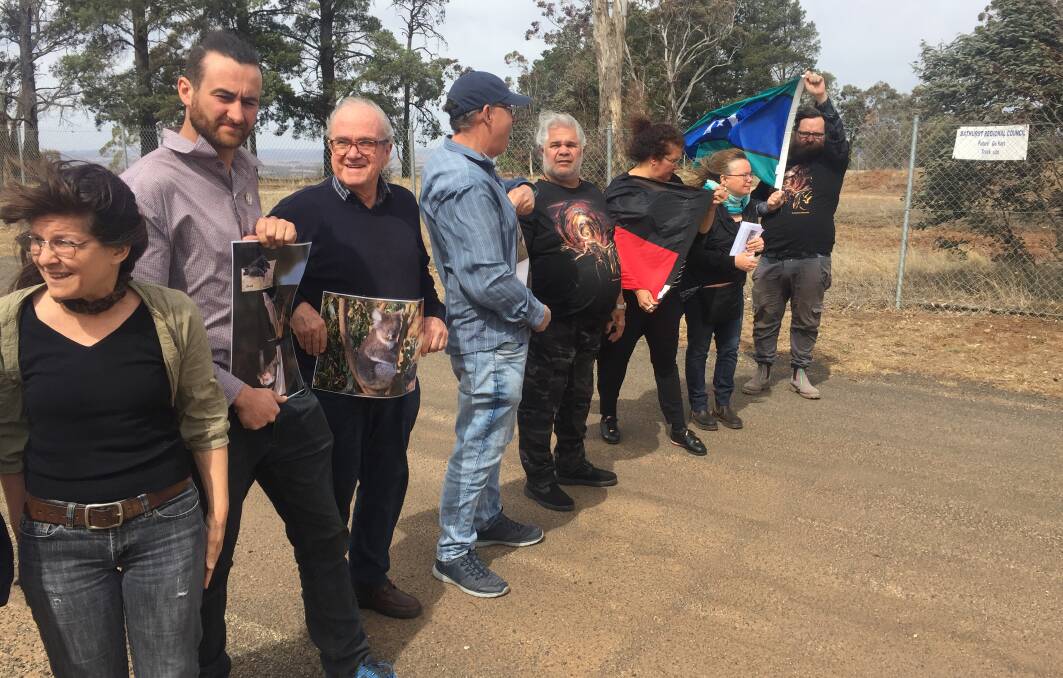 ALL TOGETHER: Citizens and organisations opposed to the site for the new go kart track protesting at the top of Mount Panorama on Friday.