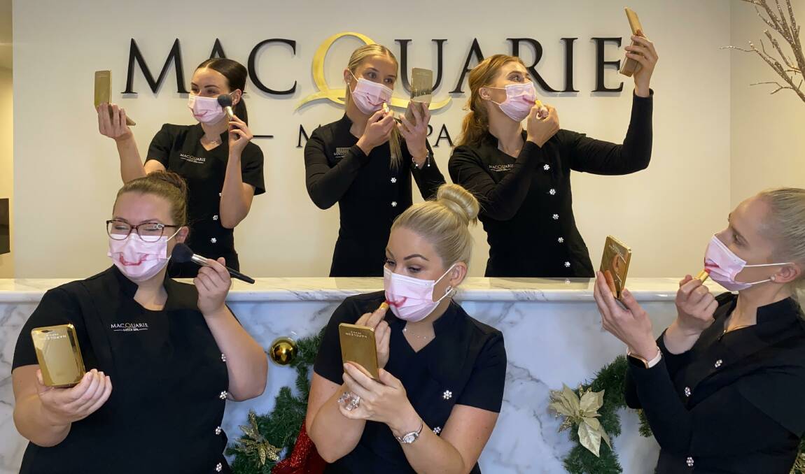 THE LOOK: Karla McDiarmid (front, centre) and the team at Macquarie Medi Spa are ready to welcome back their clients. Photo: SUPPLIED