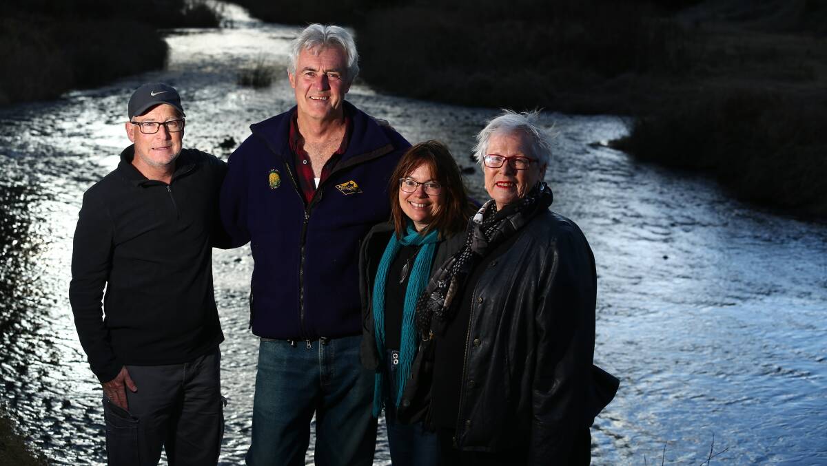 THE RIVER RUNS: David Abernethy, John Fry, Tracy Sorensen and Councillor Monica Morse celebrate beside the Macquarie River on Wednesday. Photo: PHIL BLATCH