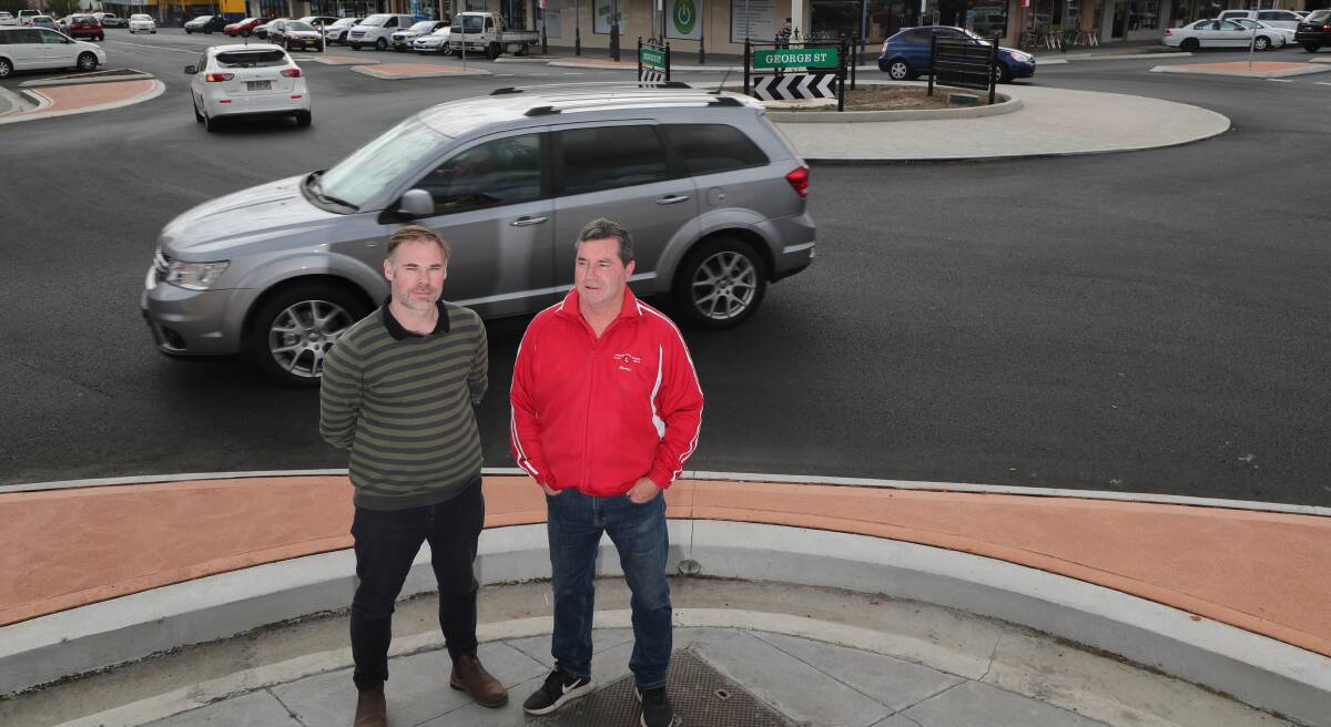 SAFETY FIRST: Road safety officer Andrew Cutts and Councillor Warren Aubin at the new roundabout. Photo: PHIL BLATCH