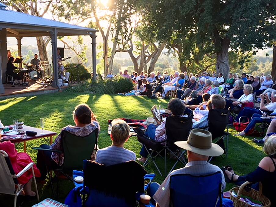PICTURE PERFECT: Visitors relax on the lawns of the magnificent Brucedale Homestead during the Brucedale Twilight Concert. Photo: ANN ROXBOROUGH, Bathurst Arts Council