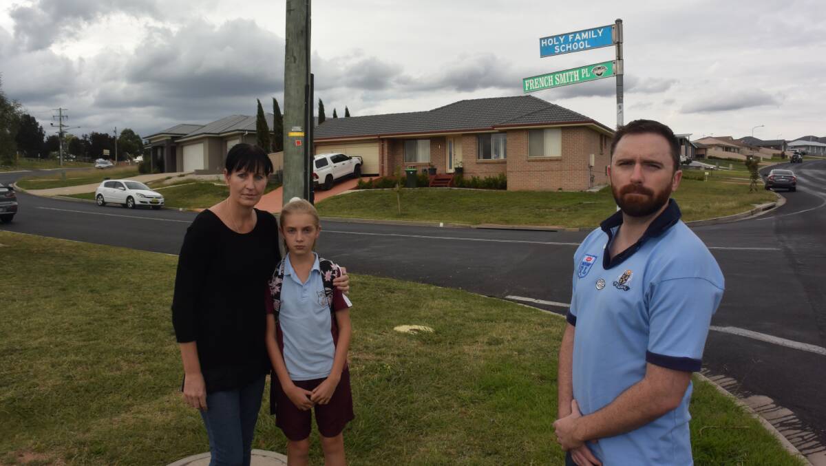 Sharon Francis with her daughter Mariah Bowrey and councillor Alex Christian on the corner of French Smith Place and Marsden Lane, near Holy Family School.