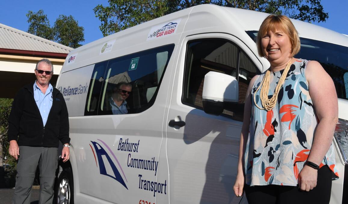 NEW WHEELS: Bathurst Community Transport CEO Kath Parnell (right) with driver Scott Gold ahead of the new bus' maiden voyage to Orange.