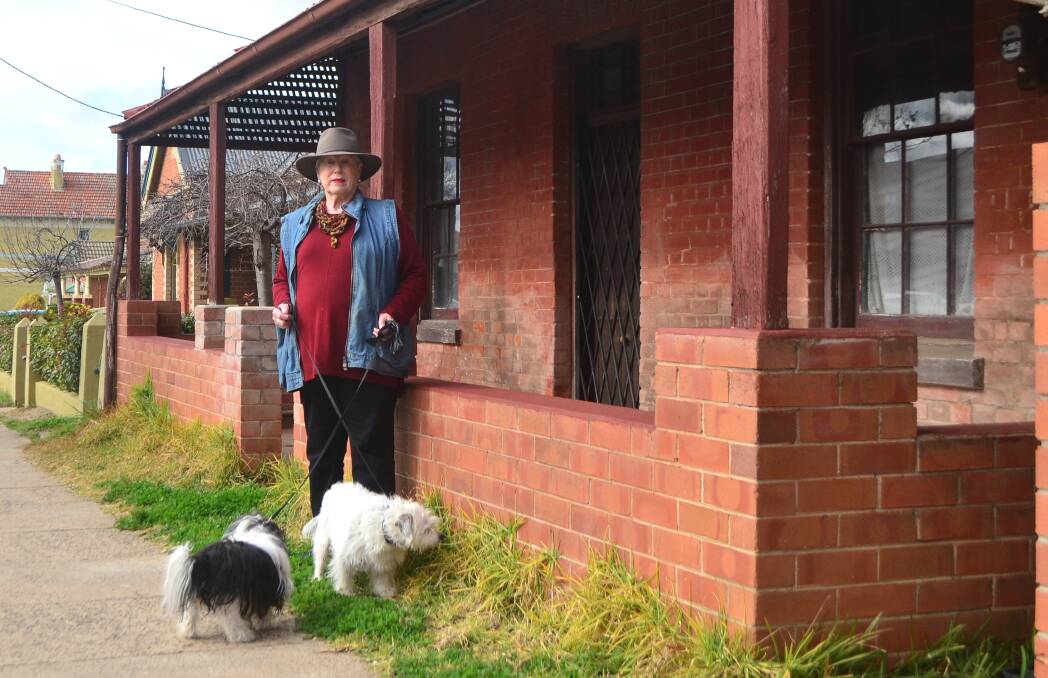 DISAPPOINTING: Councillor Monica Morse, pictured with her dogs Rosie and Sykes, says it is disappointing the house at 206 William Street has been allowed to fall into disrepair.