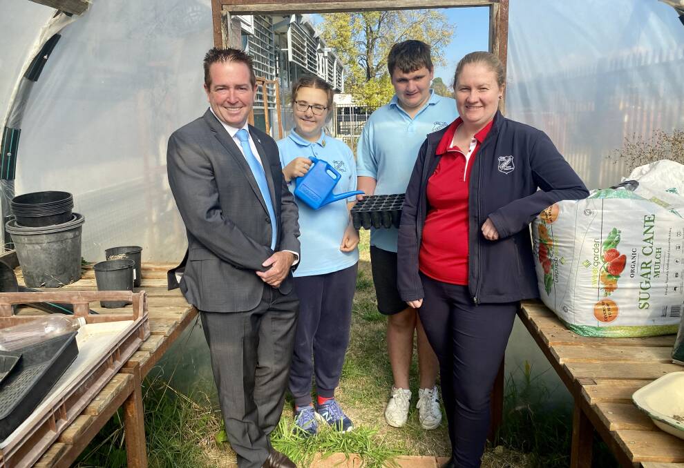 KITCHEN GARDEN: Bathurst MP Paul Toole with Carenne School teacher Allison Couchman (right) and students Bridget and Jonathan. Photo: SUPPLIED