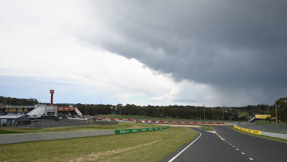 GREY SKIES: Storm clouds gathering over Mount Panorama this afternoon. Photo: CHRIS SEABROOK