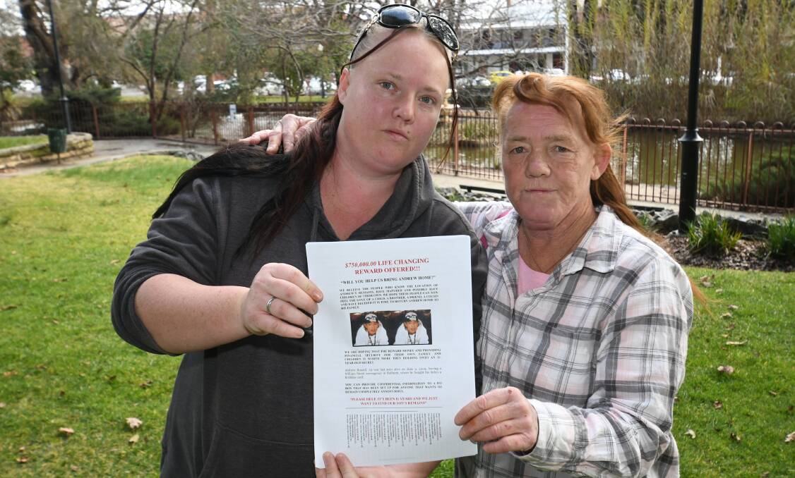 KEEP FIGHTING: Andrew Russell's sister Kiara White and mother Sue Wallace with posters seeking information about his disappearance. 