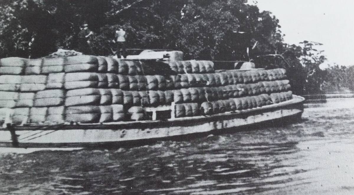 HEAVY LOAD: A riverboat loaded with about 300 bales of wool on the Darling River below Hay in the late 1890s.