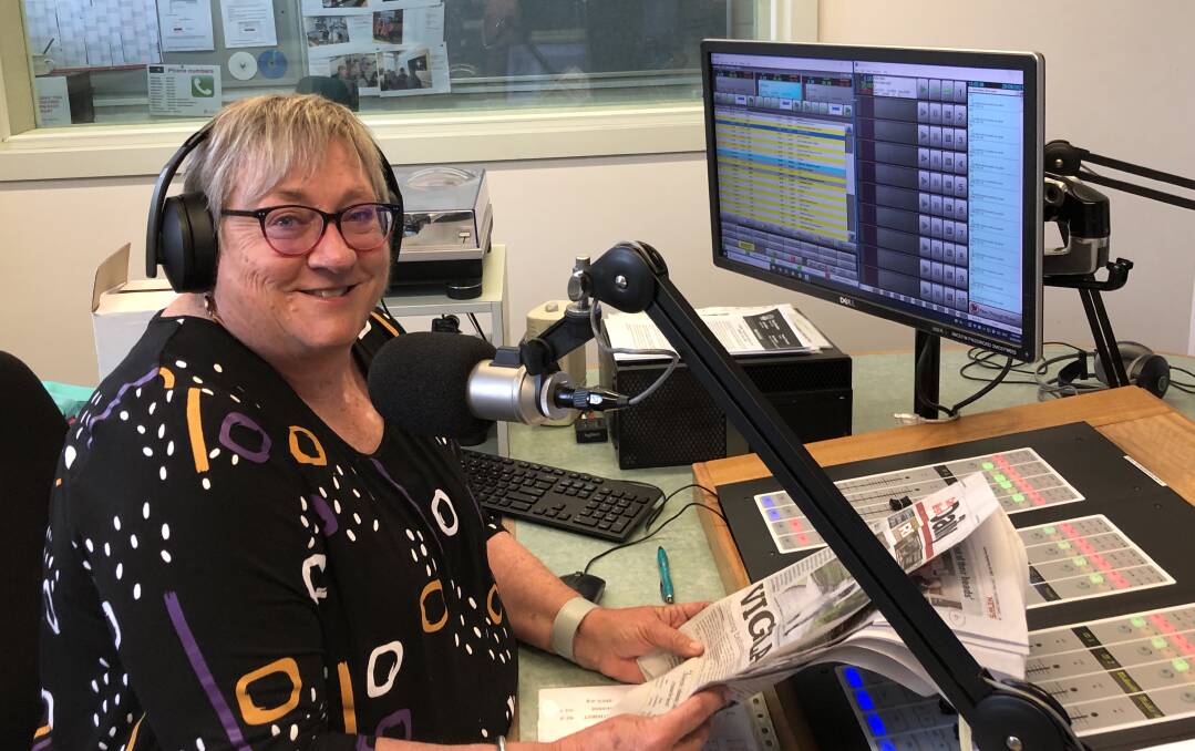 READ ALL ABOUT IT: Kerry Patten volunteering as part of the Talking Newspaper team at community radio 2MCE-FM. Photo: SUPPLIED