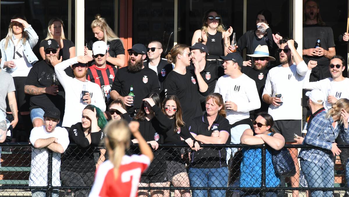 HERE'S CHEERS: Supporters were in full voice during Sunday afternoon's local football grand finals. Photo: CHRIS SEABROOK