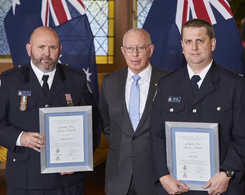 AWARDS: NSW Governor David Hurley (centre) with commendation recipients Lindsey Flynn and Scott Hoy on Tuesday. Photo: SUPPLIED