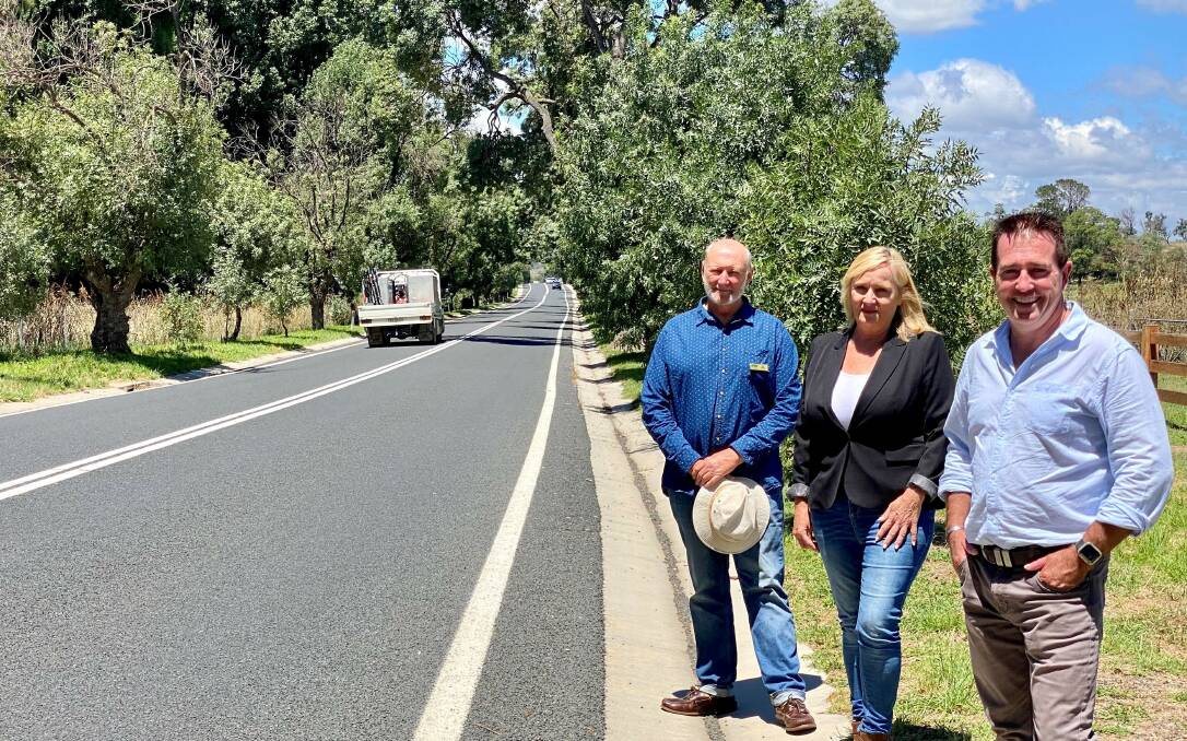 MEMORIAL AVENUE: Bathurst M Paul Toole (right) with Lauren Trembath and Oberon councillor Ian Doney at OConnell where the Anzac War Memorial Avenue of desert ash trees will be given expert attention by arborists. Photo: SUPPLIED