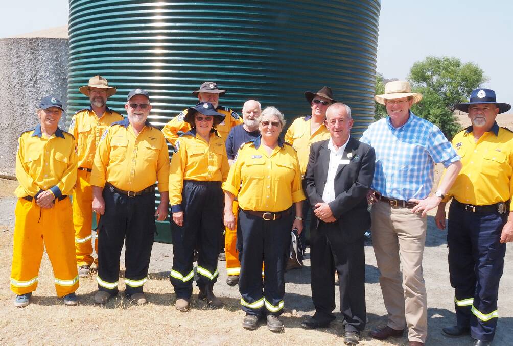 WATER WISE: Bathurst mayor Bobby Bourke and Calare MP Andrew Gee with members of the Freemantle RFS. Photo SUPPLIED