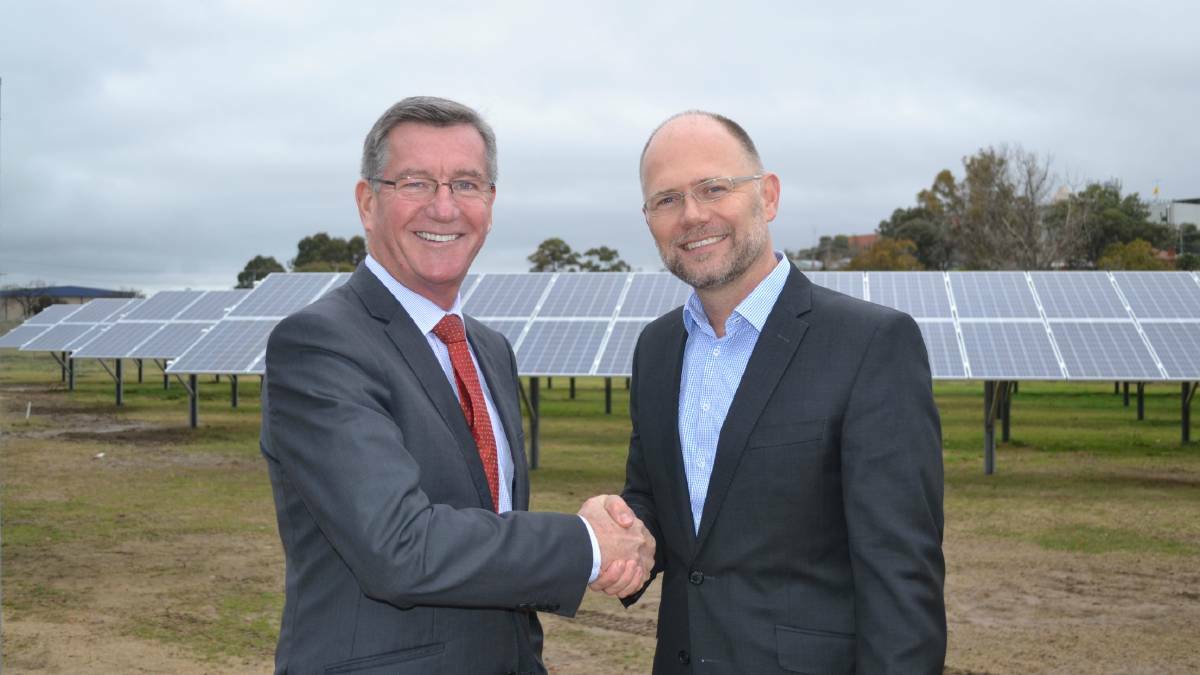 JOB WELL DONE: Mayor Gary Rush and Epho’s managing director Oliver Hartley with the 100 kilowatt solar array at the Wastewater Treatment Plant. Photo: RACHEL FERRETT 061716rfgrid1