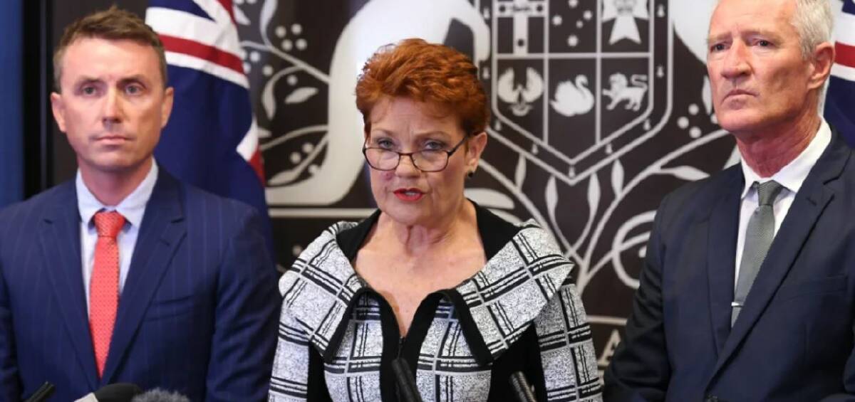 SURVIVOR: One Nation leader Pauline Hanson, flanked by party officials James Ashby and Steve Dickson, at a press conference on Thursday. Photo: AAP