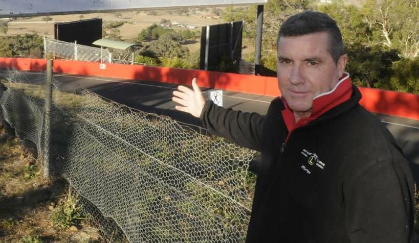 SUPPORT: Councillor Warren Aubin, pictured on Mount Panorama, has urged local businesses to do more to embrace the Bathurst 1000.