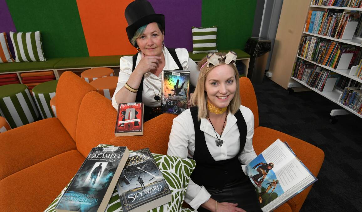 GOOD FUN: Rhiannon Mijovic and Natalie Conn dressed in Steampunk attire for the coming Bathurst Library school holiday workshops. Photo: CHRIS SEABROOK 092319cpunk1