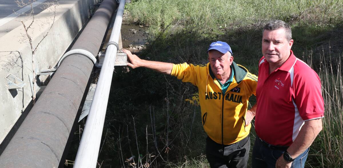 WATER OPTIONS: Councillors Bobby Bourke and Warren Aubin with water pipes running alongside the Hereford Street bridge. Photo: PHIL BLATCH